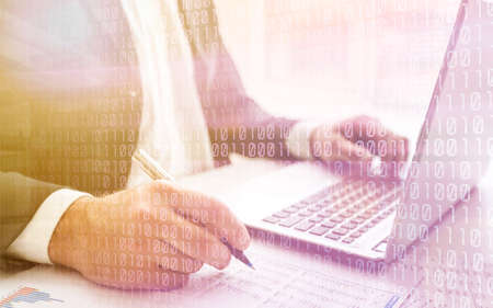 business documents on office table with smart phone and digital tablet and graph business diagram and man working in the backgroundの写真素材