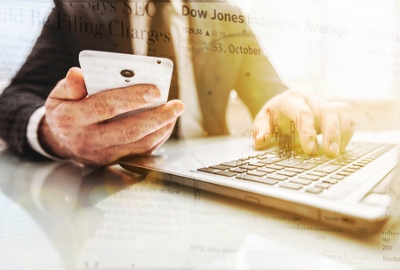 business man hand working on laptop computer with digital layer business graph information diagram...