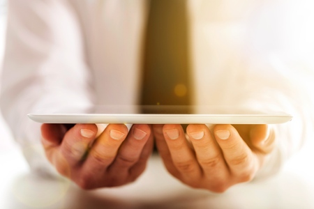 Business man holding  digital tablet,close up