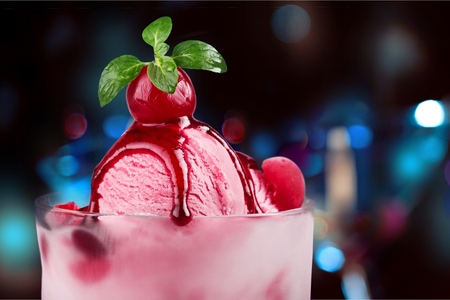 Strawberry ice cream in cup on white backgroundの写真素材