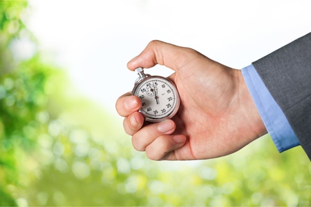 holding stop watch