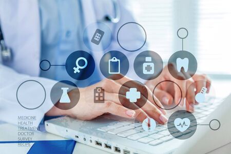 Man typing on laptop, close-up viewの写真素材