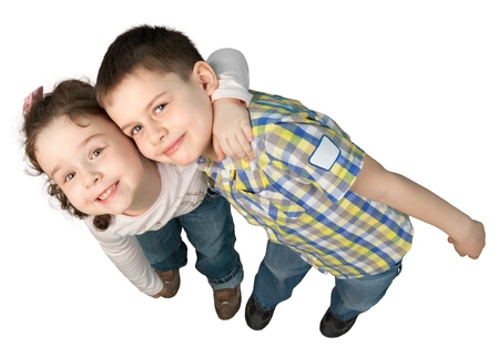 Portrait of cute little boy and girl together isolated on white backgroundの写真素材