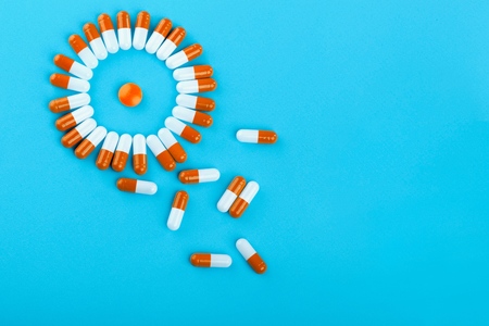 Prescription antibiotic drug medication pills on a bright colourful background. Health care conceptの写真素材