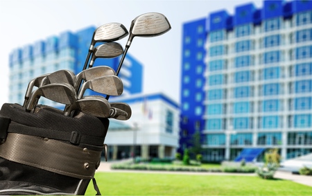 Golf Bag and Clubs Against Grassの写真素材