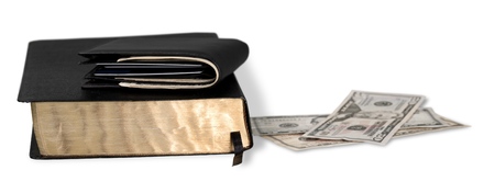 Bible with Money and Wallet