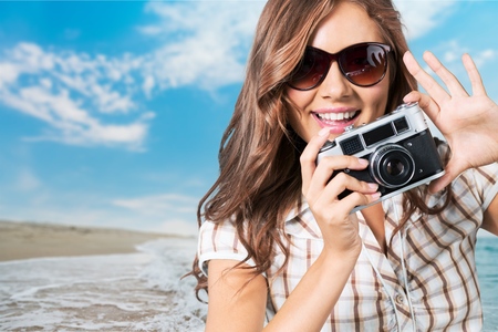 Young woman girl photographer with cameraの写真素材