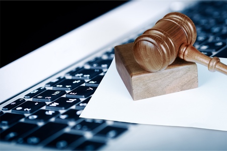 Laptop and judge gavelの写真素材