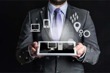 Female hands touching tablet with white cloud conceptの写真素材