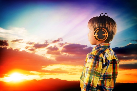 dreams of flight! child playing with toy airplane against the sky at sunsetの写真素材