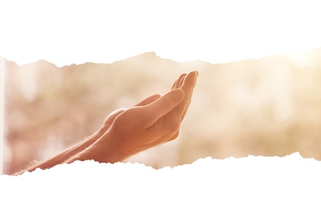 Human hands open palm up prayingの写真素材