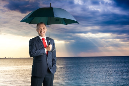 Businessman - Holding an unbrellaの写真素材