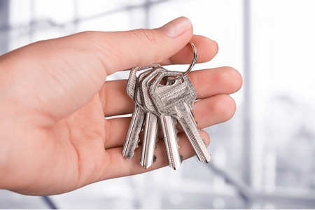 Real Estate agent hands over the keys.