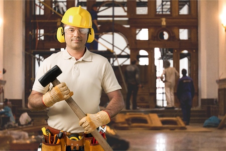 Carpenter Contractor Man Wearing Gogles Toolbelt Hardhat Isolated on White