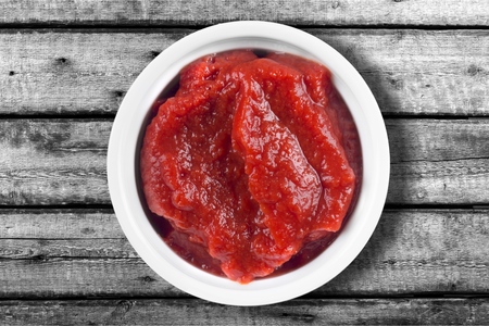 Bowl of ketchup or tomato sauce isolated  on white background, top viewの写真素材