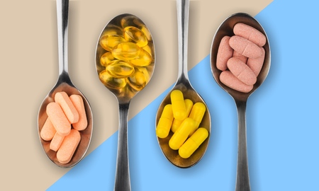 Healthy supplements on teaspoonsの写真素材