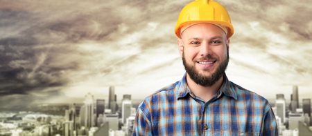 Man bricklayer with yellow hemlet