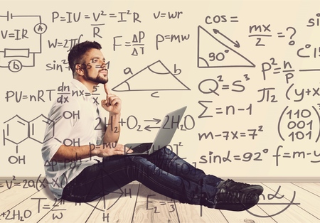 Senior man working on computer sitting