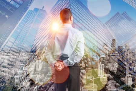 Businessman on sity background