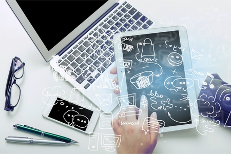 Man hand working on tablet with computer background. Technology.の写真素材