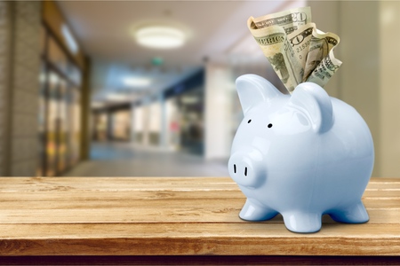Stuffed piggy bank with US dollars