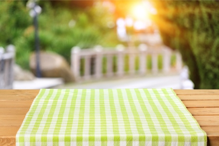 Table with cloch on the parkの写真素材