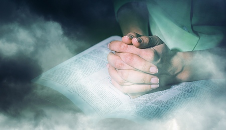 Woman Praying over Bibleの写真素材