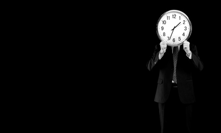 Image of businessman holding alarmclock against illustration background. Collageの写真素材