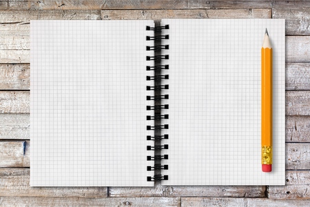 White notebook and pencil