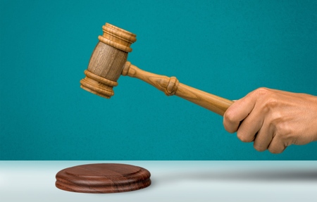 Gavel over the opened law bookの写真素材