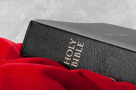 Holy Bible on red cloth