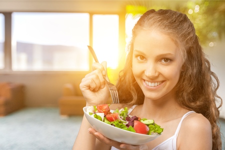 Woman eating healthy foodの写真素材