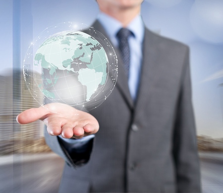 Businessman holding global network and data exchanges over the world 3D renderingの写真素材