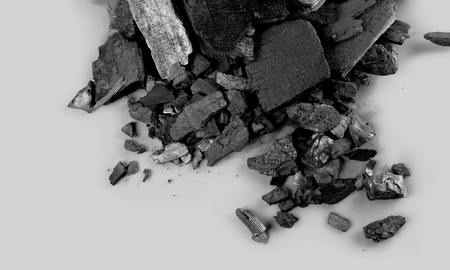 charcoal prepared to burn isolated on white