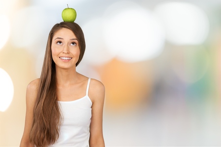 apple on her headの写真素材