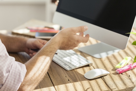 Man working on laptop in the office