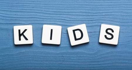 Kids text on a wooden backgroundの写真素材