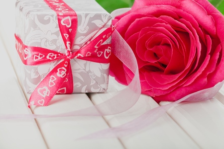 Bouquet of roses and gift box on white backgroundの写真素材