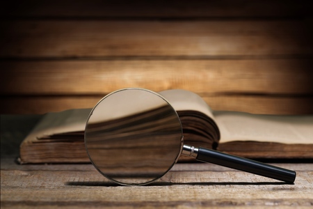 Vintage book and magnifying glassの写真素材