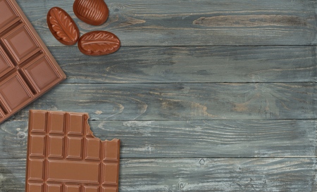 Milk chocolate pieces on desk