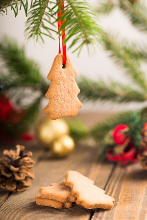 Tasty Christmas cookies with red ribbon on backgroundの写真素材