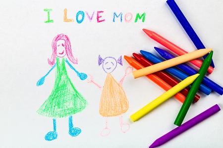 Child drawing of her mother for mother's dayの写真素材