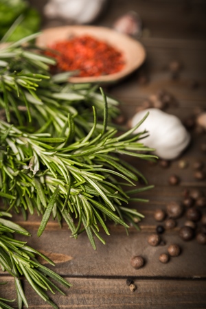 Spices and herbs on a wooden background (and space for text), verticalの写真素材
