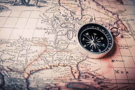 old compass on a mapの写真素材