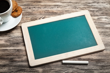 infographics, visual, content, knowledge word cloud on a blackboard with a cup of coffeeの写真素材