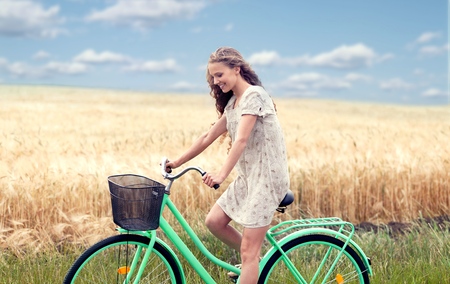 beautiful blonde on a bicycle. vintage photoの写真素材