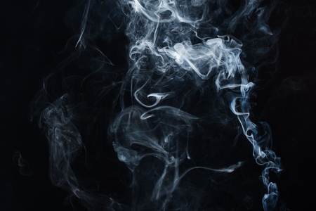Black smoke on a white backgroundの写真素材