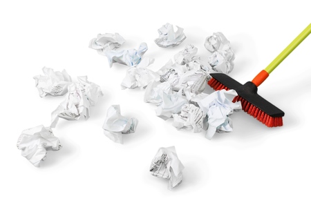 Broom Sweeping Crumpled Paperの写真素材