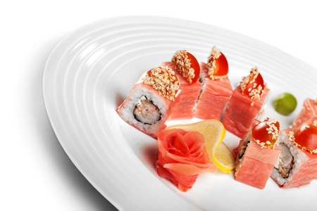 Tasty Sushi rolls on plate on  backgroundの写真素材