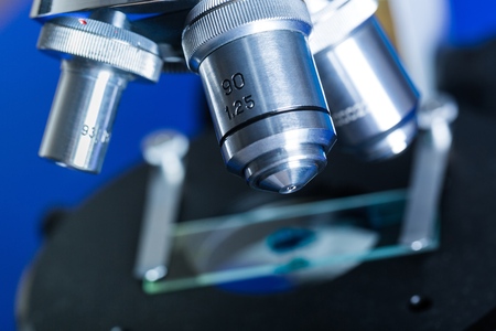 Closeup of Microscope Lenses and Slide